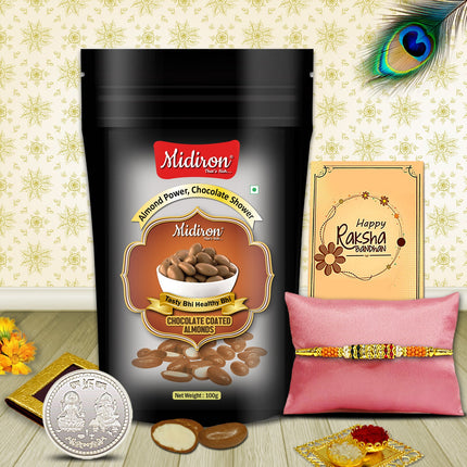 Raksha Bandhan hamper with festive essentials — designer Rakhi, silver coin, sweets pouch, greeting card, and roli-chawal bowls.