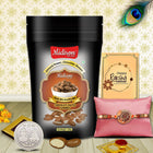 Rakhi gift pack highlighting chocolate almonds, handcrafted Rakhi, silver coin, and greeting card with roli-chawal for rituals.
